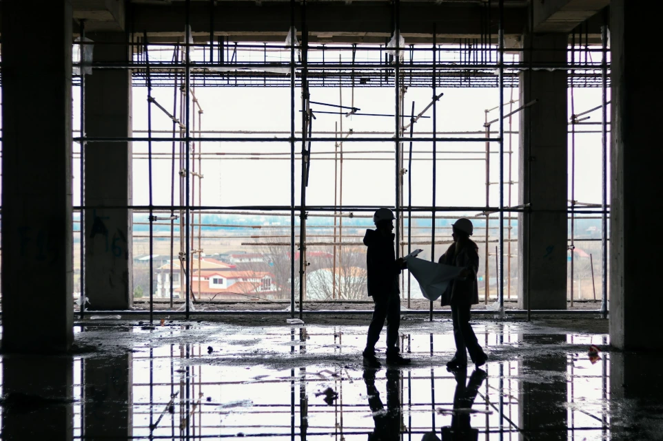 a couple of people that are standing in a building